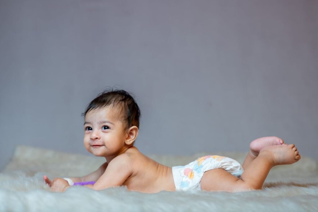 when do babies roll over from back to tummy